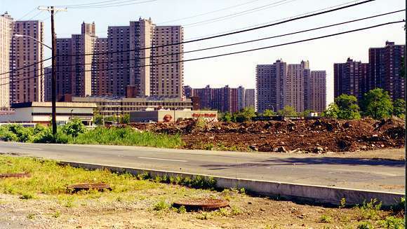 View Northeast of Coop City Behind Shopping Center